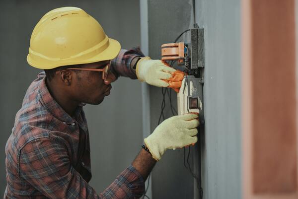 A man working with electric cables